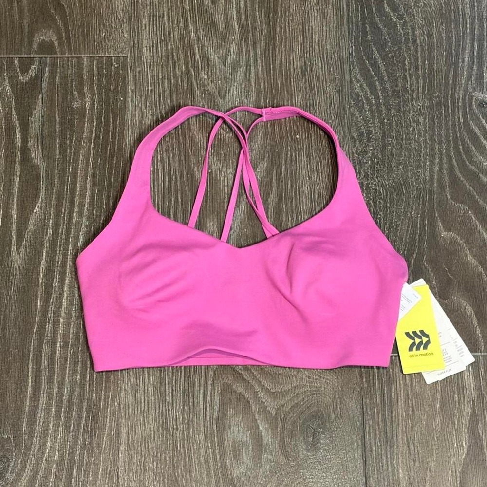 Hot pink sports bra with criss-cross back straps